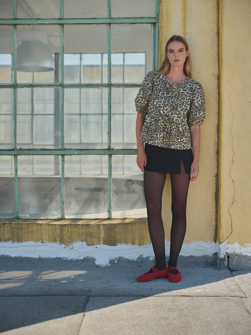 ANIMAL PRINT BOW TIE PEPLUM BLOUSE