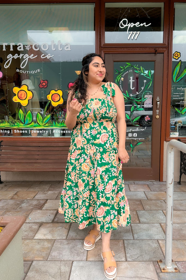girl wearing a Green Smocked Floral Print Dress