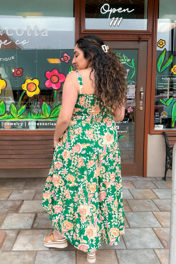 girl wearing a Green Smocked Floral Print Dress back view